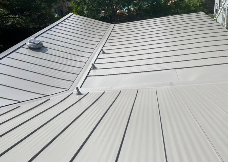 Solar attic fan installed on a metal roof for Roof Ventilation in Shakopee